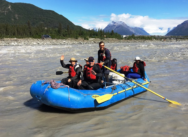 Jonny and his raft are full of smiles as they push off down the Kennicott River on our Three Rivers Rafting trip!