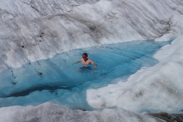 Ethan, enjoying (or maybe not) an ice cold swim while backpacking across the Kennicott Glacier. Brrrr!