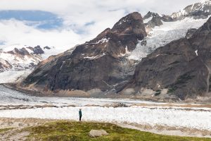 hiker with alaska glaciers
