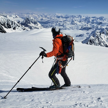 Skier looks upon the Chugach Mountains on a backcountry skiing trip