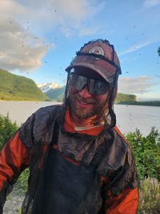 Smiling guide in a full bug net