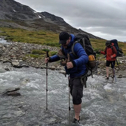 People Crossing A River