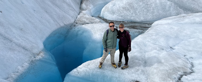 Couple hiking Alaskan glacier