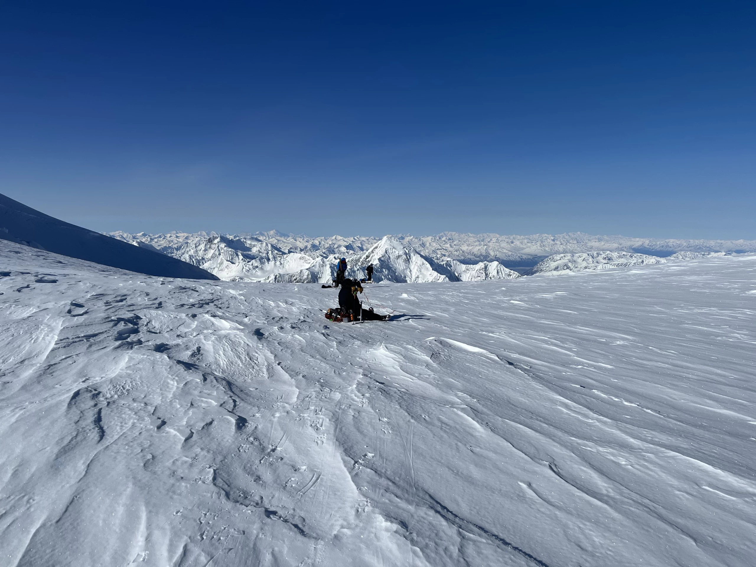 Two rope teams catching a quick break on the final push to the summit