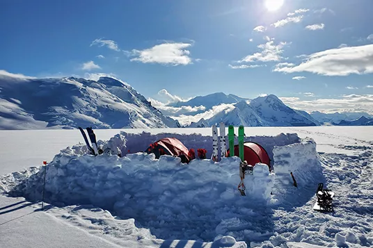 Snow walls enclose a ski camp in Alaska