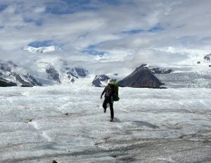 Person walking on glacier