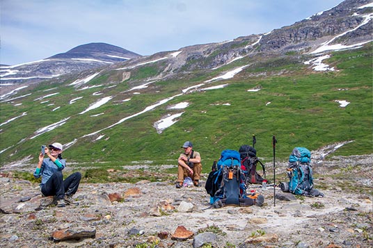 Backpackers take their packs off for a break in the Alaskan backcountry