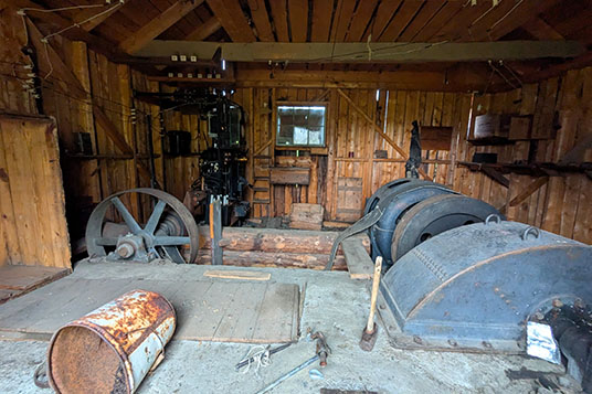 Old industrial equipment in a wooden cabin