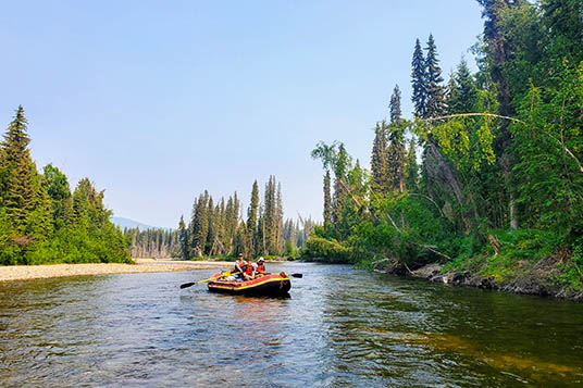 A red raft on the Charley River in Alaska