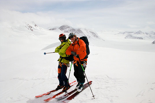 Two skiers look cool in the backcountry in Alaska