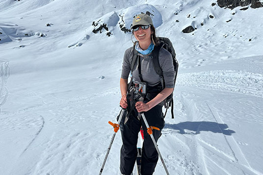 A backcountry skier on a hot day on the snow in Alaska