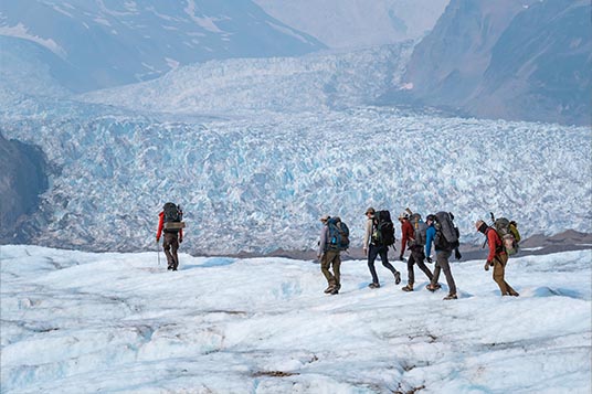 A guide leads a group of Backpackers through the Kennicott Glacier
