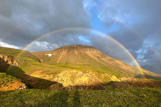 A rainbow over the tundra in evening light