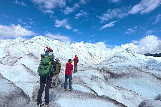 Hikers near compression fins on the Kennicott Glacier