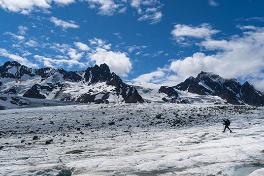 A backpacker on a huge glacier in Alaska
