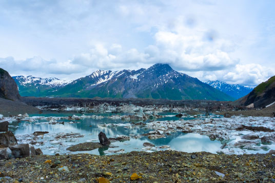 Iceberg-filled lake in front of a mountain in Alaska