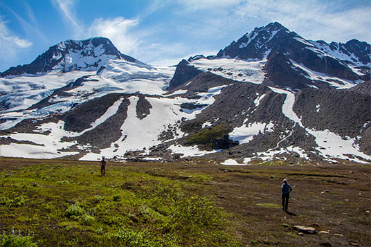 Small hikers dwarfed by beautiful mountains in Alaska