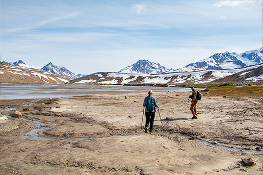 Two hikers in the backcountry of Wrangell St. Elias National Park