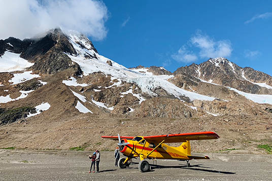 A bush plane and people at Iceberg Lake