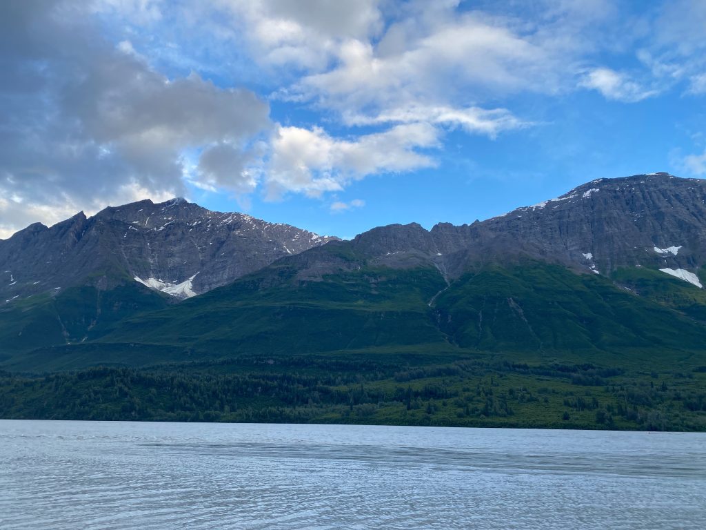Snowy mountains overlook wide river